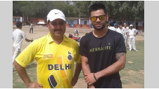 Kohli with coach Rajkumar Sharma