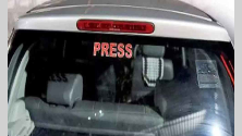 Vehicle with PRESS sticker