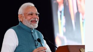 Specially-abled girl presents portraits to PM Narendra Modi and Spanish President during a roadshow in GUJ