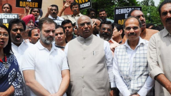 A day after Leader of Congress in Lok Sabha Adhir Ranjan Chowdhury was suspended from the House for his objectionable remarks on Prime Minister Narendra Modi, the INDIA parties on Friday staged a protest in the Parliament with grand old party chief Mallikarjun Kharge alleging that the government wants to “suppress democracy” and does not want to “follow the Constitution” to run the House.