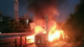 At least six people were killed and 20 others seriously injured on Saturday after a fire erupted inside the coach of a passenger train at the Madurai railway station in Tamil Nadu.