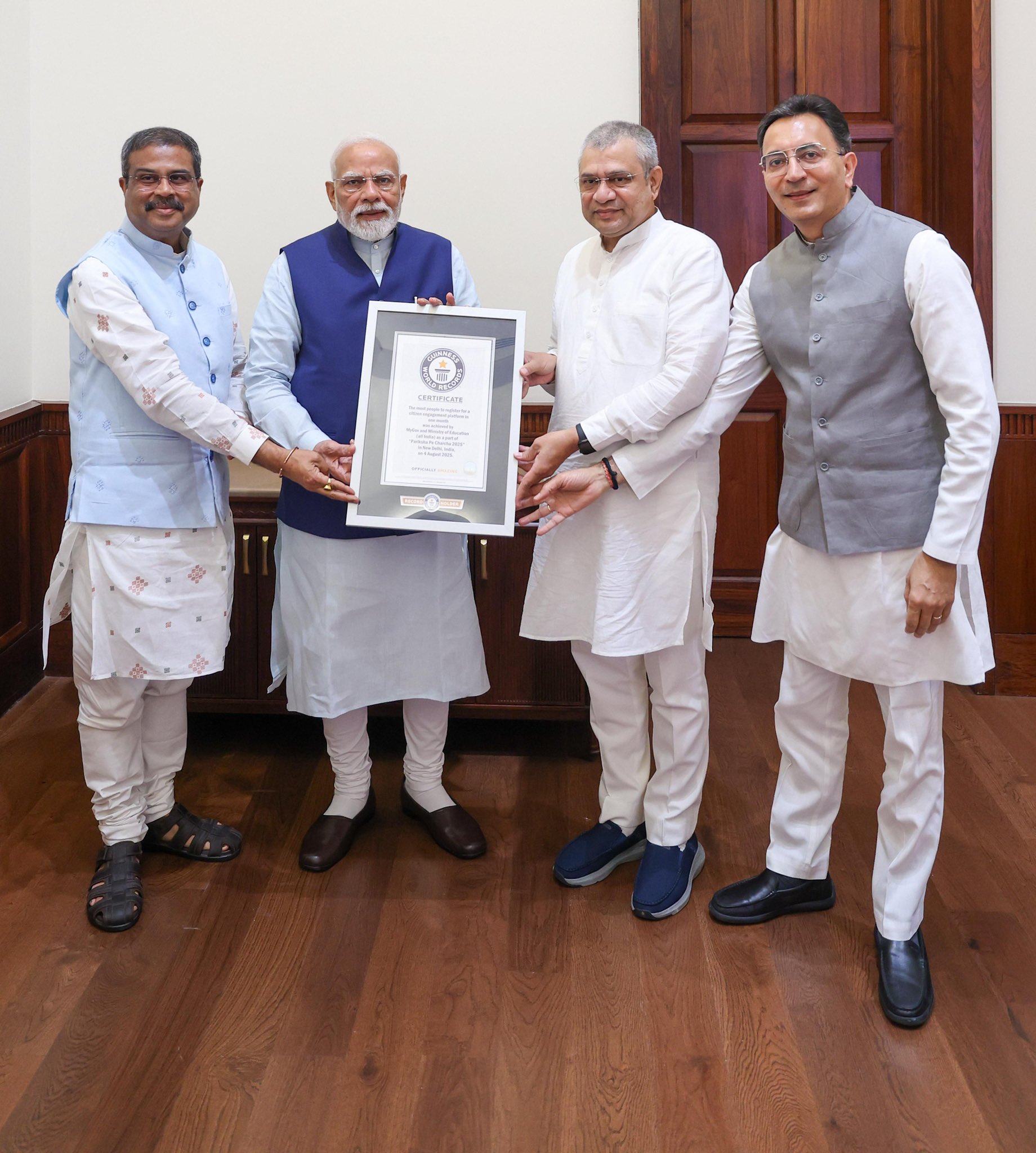 Union Ministers Pradhan & Vaishnaw present Guinness World Record Certificate for ‘Pariksha Pe Charcha’ to PM