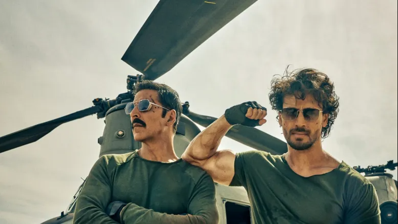  Akshay and Tiger took to their respective Instagram accounts, where they shared a new picture posing in army green T-shirts paired with camouflage pants posing in front of a chopper